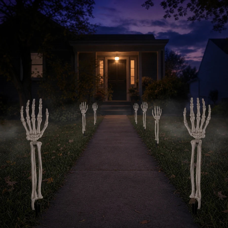 Five pairs planted at different depths along a front walk at dusk