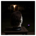 Cindervale Figure on a porch at night